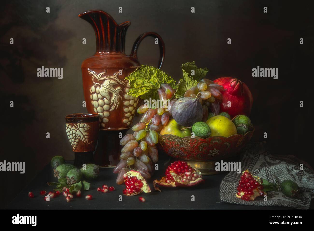 Still life with fruits and wine jug Stock Photo - Alamy
