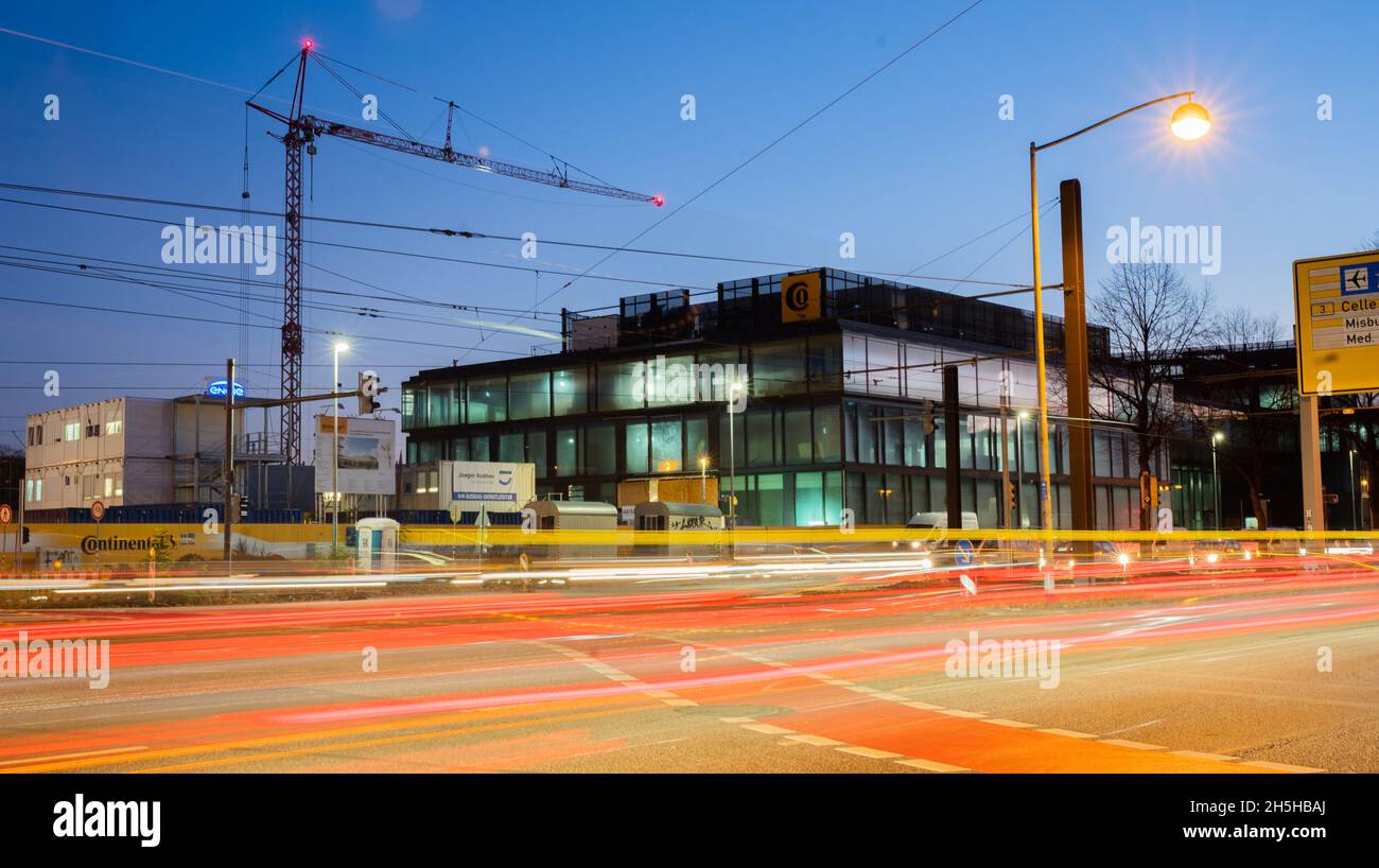 Hanover, Germany. 10th Nov, 2021. Cars drive past the new building of