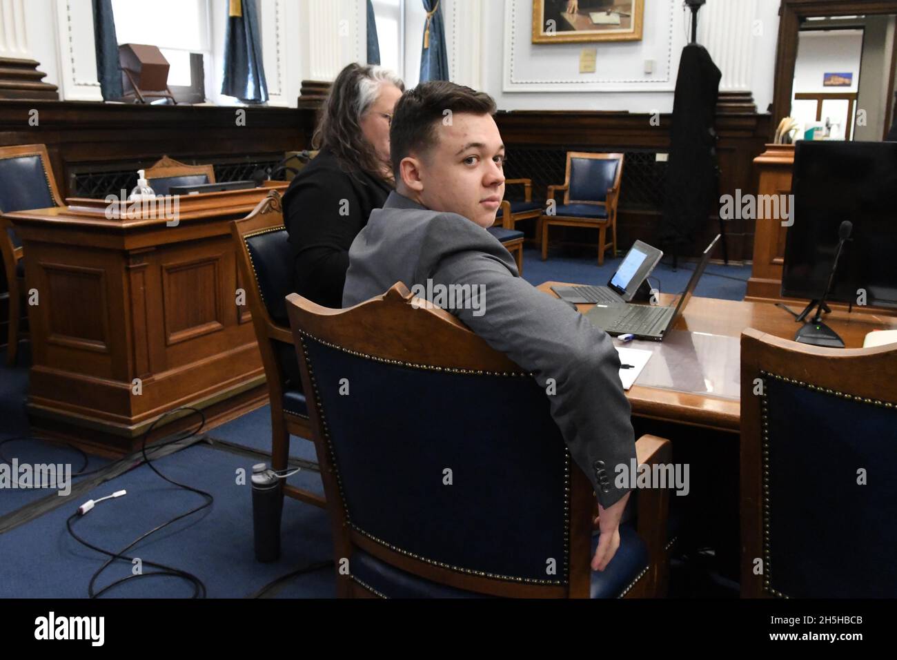 Kenosha, Wisconsin, USA. 9th Nov, 2021. Defendant KYLE RITTENHOUSE, 18, looks back where his family seats. As they wait for court to begin his trial for murder in Kenosha Circuit Court Tuesday. Rittenhouse faces seven charges. (Credit Image: © Mark Hertzberg/ZUMA Press Wire) Stock Photo