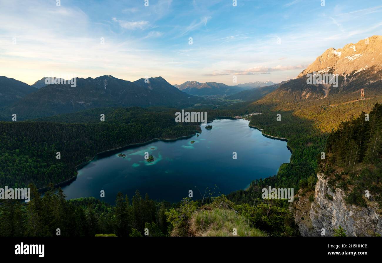 View over the Eibsee lake at sunset, Zugspitze massif, alpenglow, in ...