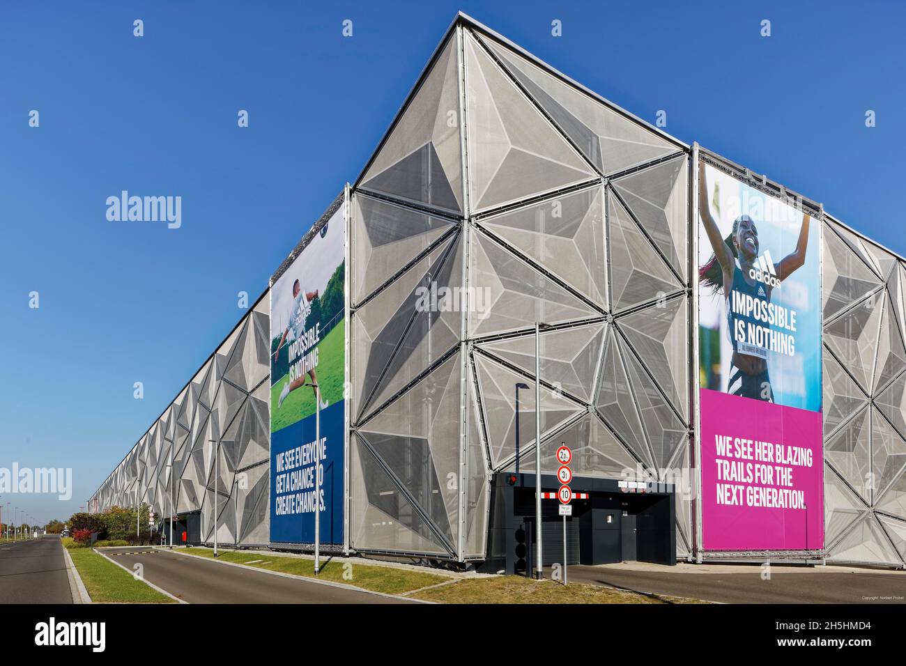 Modernity, architecture, Adidas car park with Adidas AG advertising, World  of Sports Arena, artificial pond with planting, Herzogenaurach, Middle  Stock Photo - Alamy