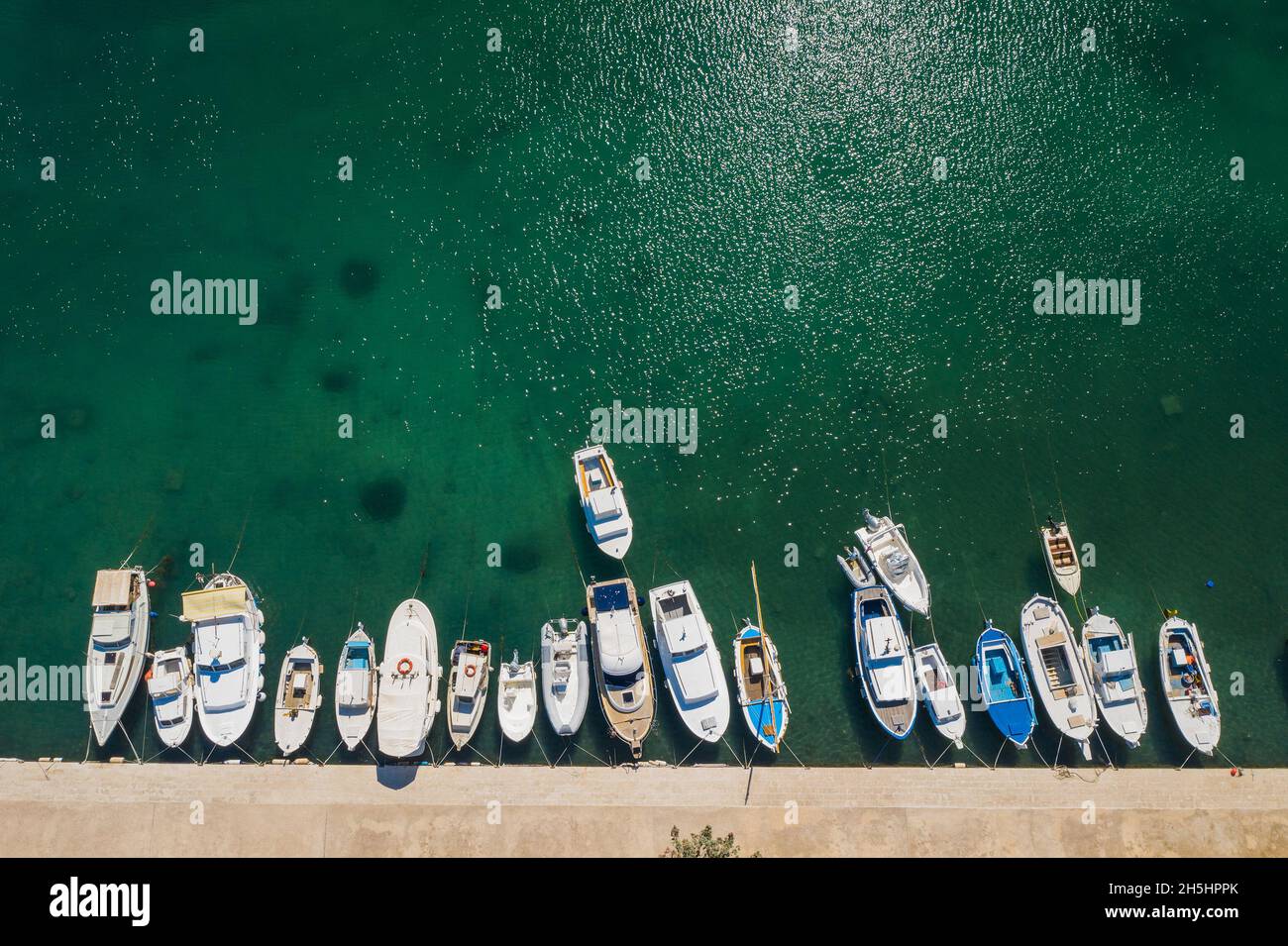 Yachts and boats in marina in town of Jezera, Murter island, Adriatic sea in Croatia, drone overhead view Stock Photo