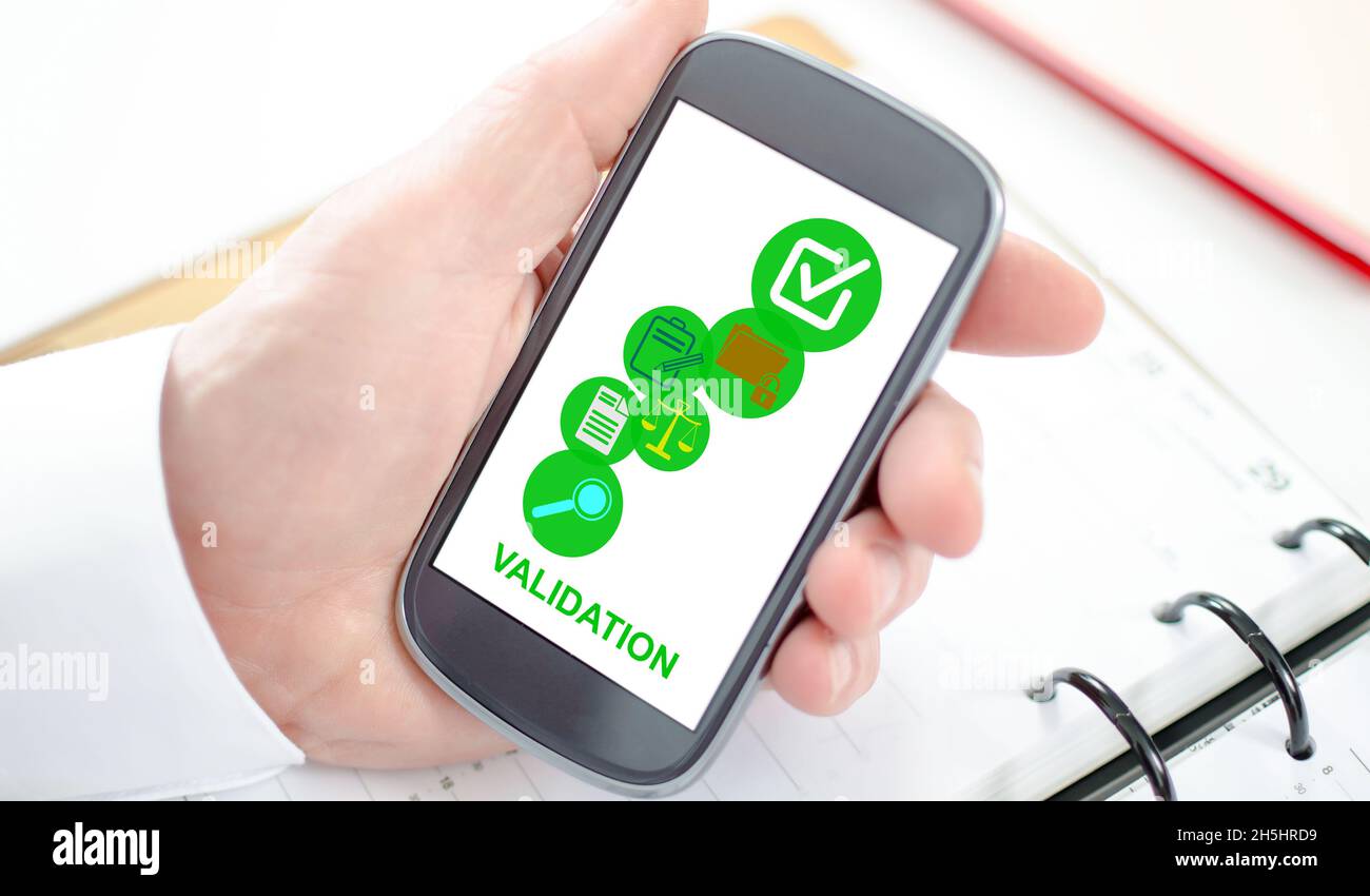 Validation concept shown on a smartphone screen Stock Photo