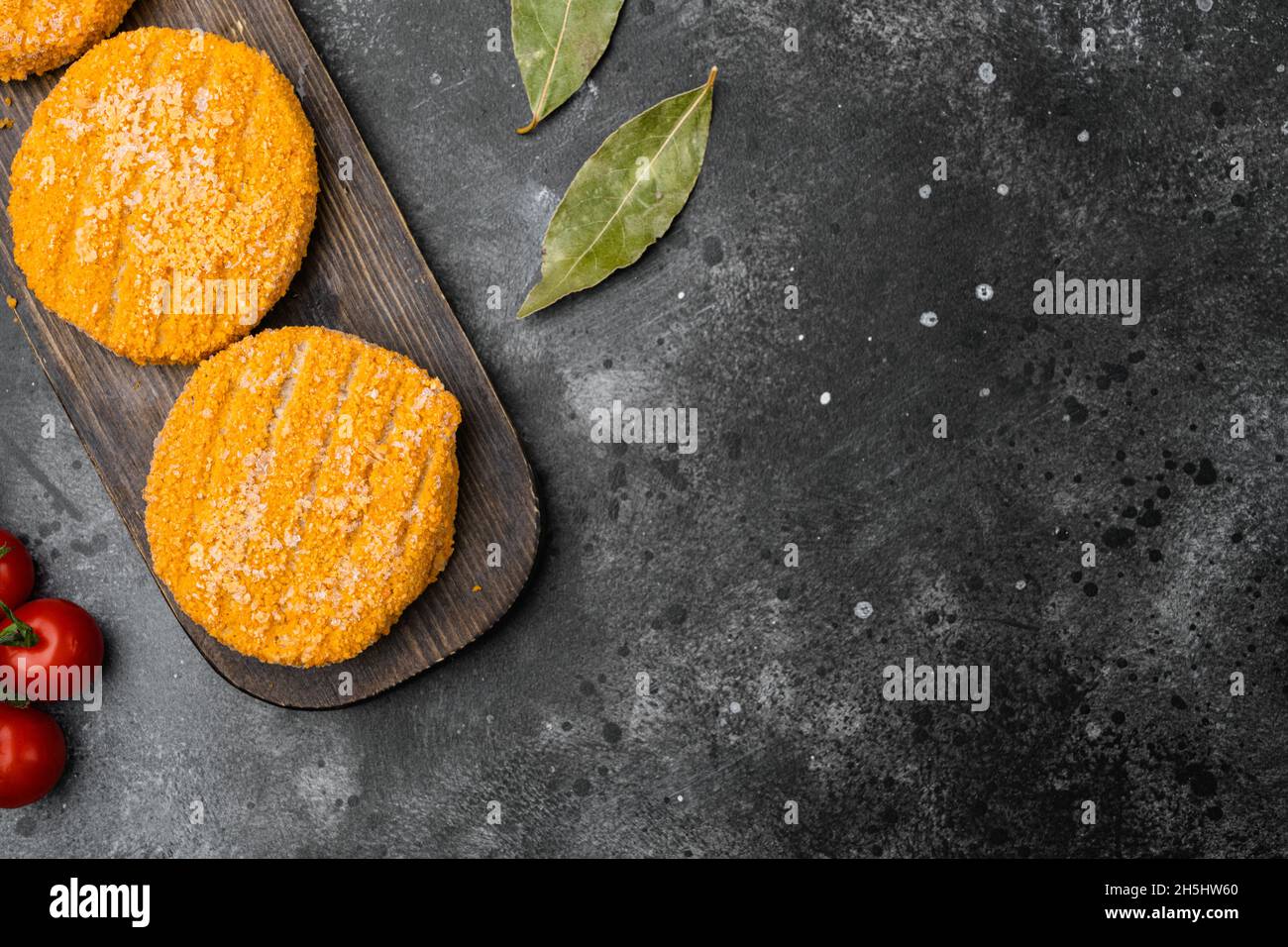 Raw fishcake Breaded set, on black dark stone table background, top ...