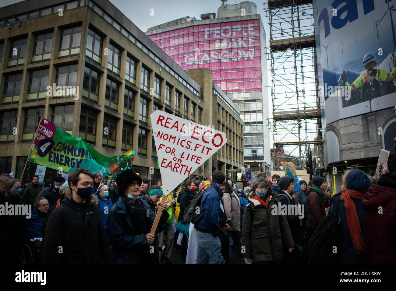 A group of climate protestors and activists march through George Square in Glasgow, showing that people do make Glasgow Stock Photo