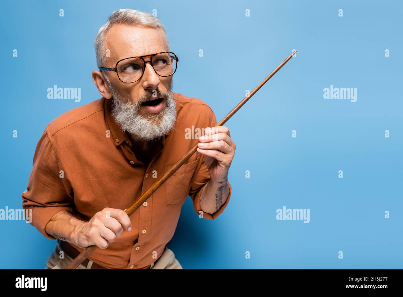 Mature teacher holding glasses hi-res stock photography and images - Alamy