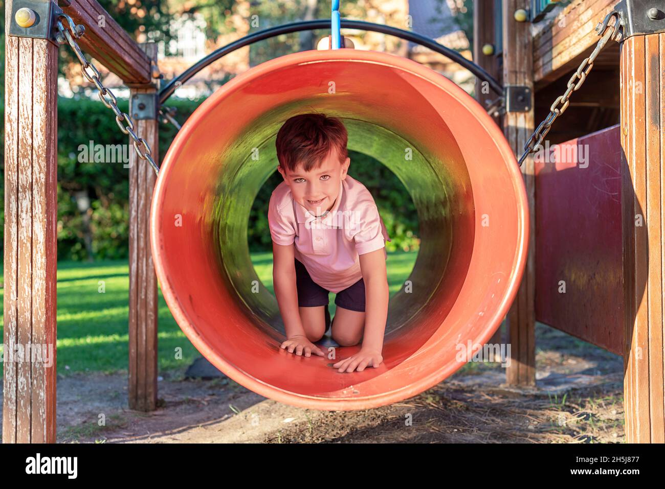 Green-eyed boy smiling while playing in a playground Stock Photo - Alamy