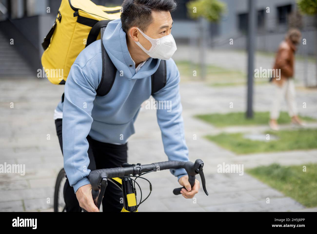 Courier search client place on smartphone in city Stock Photo