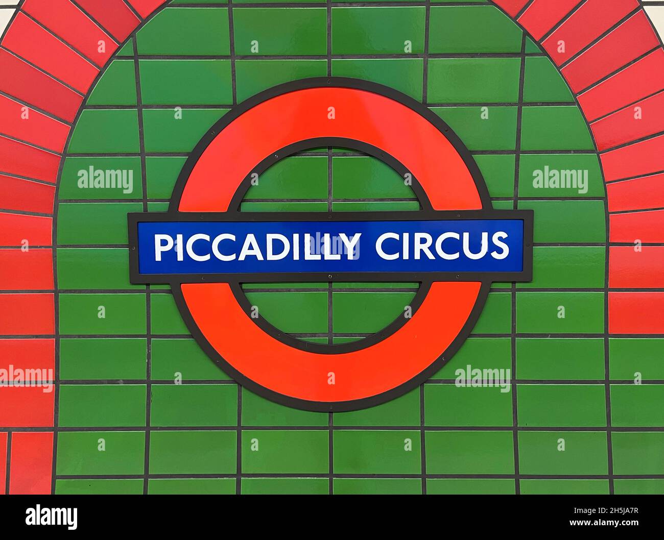 London / UK - 7th November 2021 - Piccadilly Circus station sign on a platform wall in the London underground Stock Photo