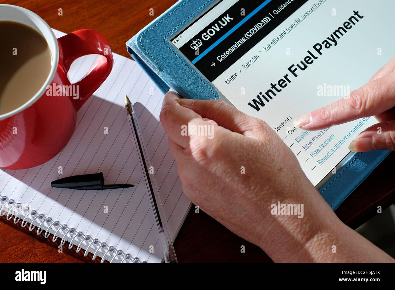 uk government winter fuel payment homepage on tablet computer screen, norfolk, england Stock Photo