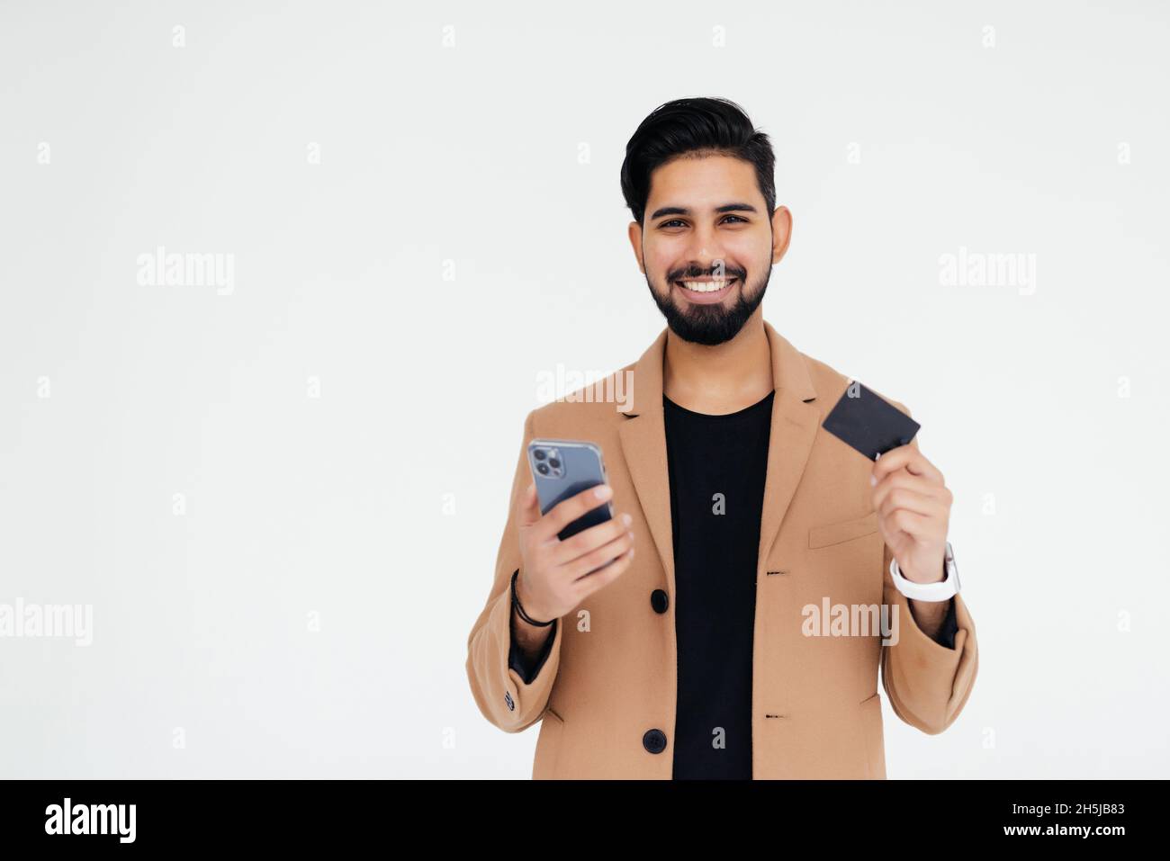 Online shopping and banking. indian business man holding credit card ...