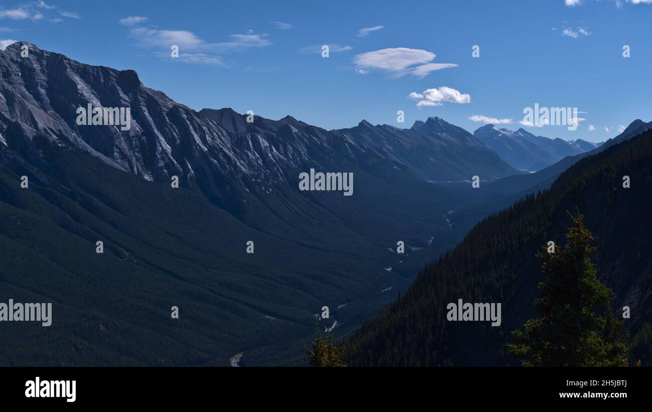 Beautiful view of the rugged Rocky Mountains near Banff, Banff National Park, Alberta, Canada with Rundle Group and Spray River valley and forests. Stock Photo