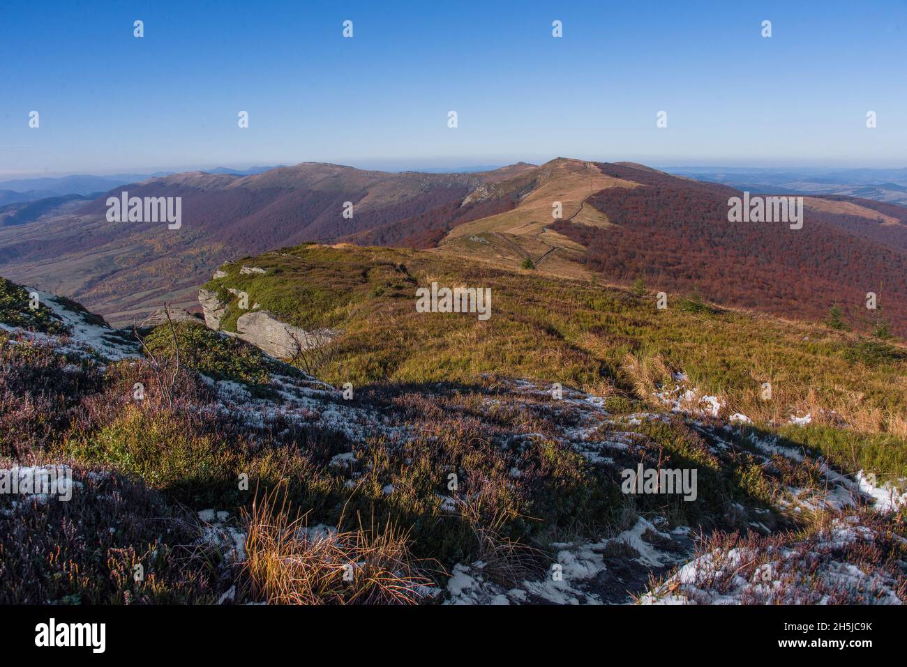 View of hills of vast Water Dividing ridge covered in red, orange and ...