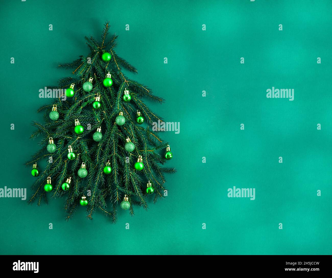 Christmas green background. Pine branches, needles and Christmas tree ...