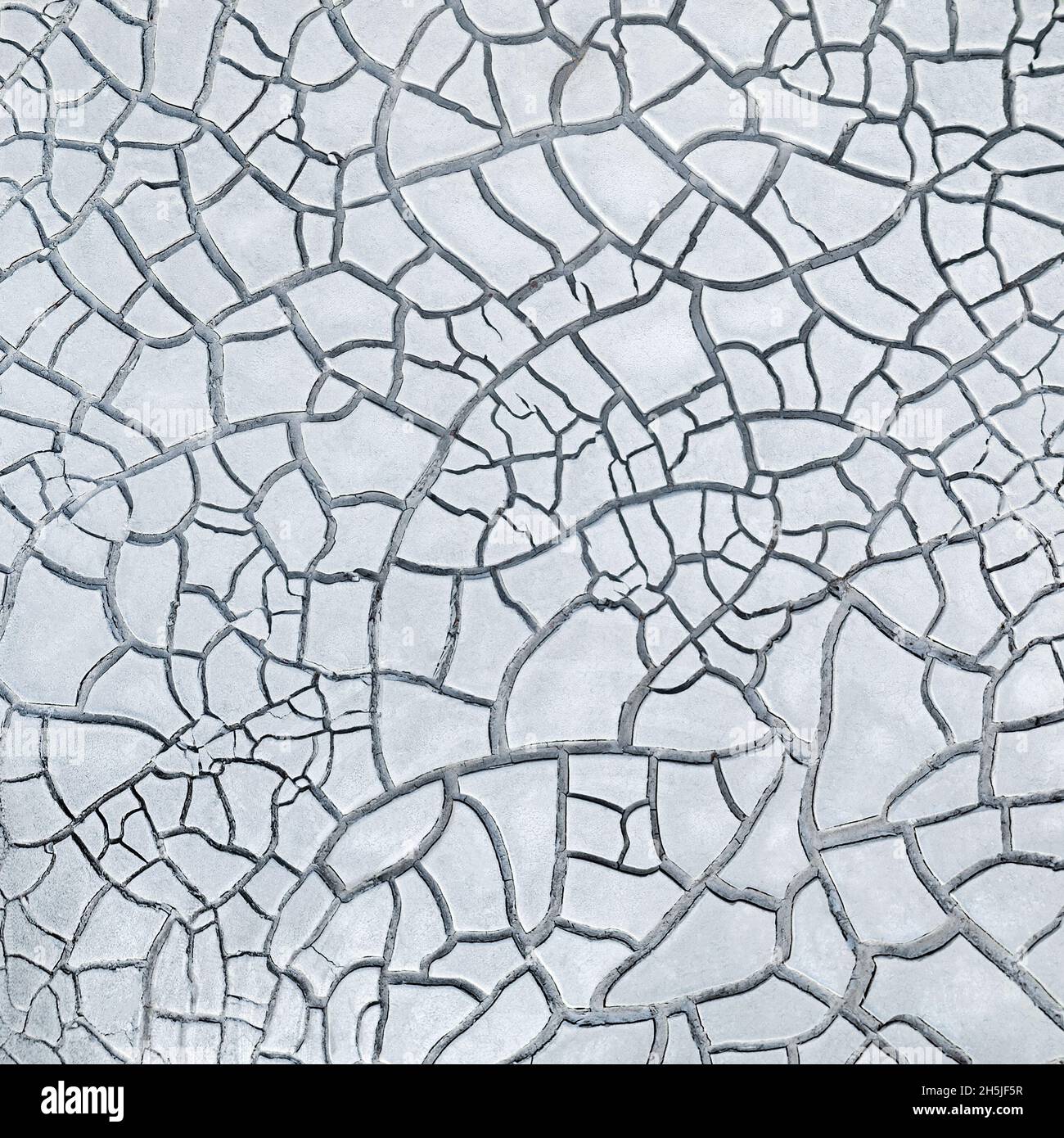 Cracked white clay, dried lakebed surface texture Stock Photo