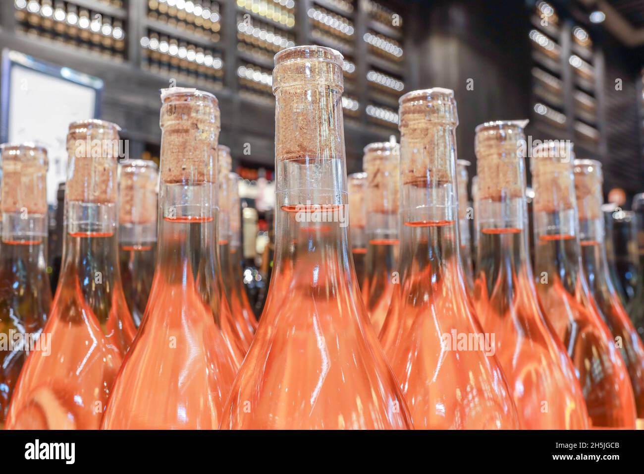 Several alcoholic beverage bottles in a liquor store. Stock Photo