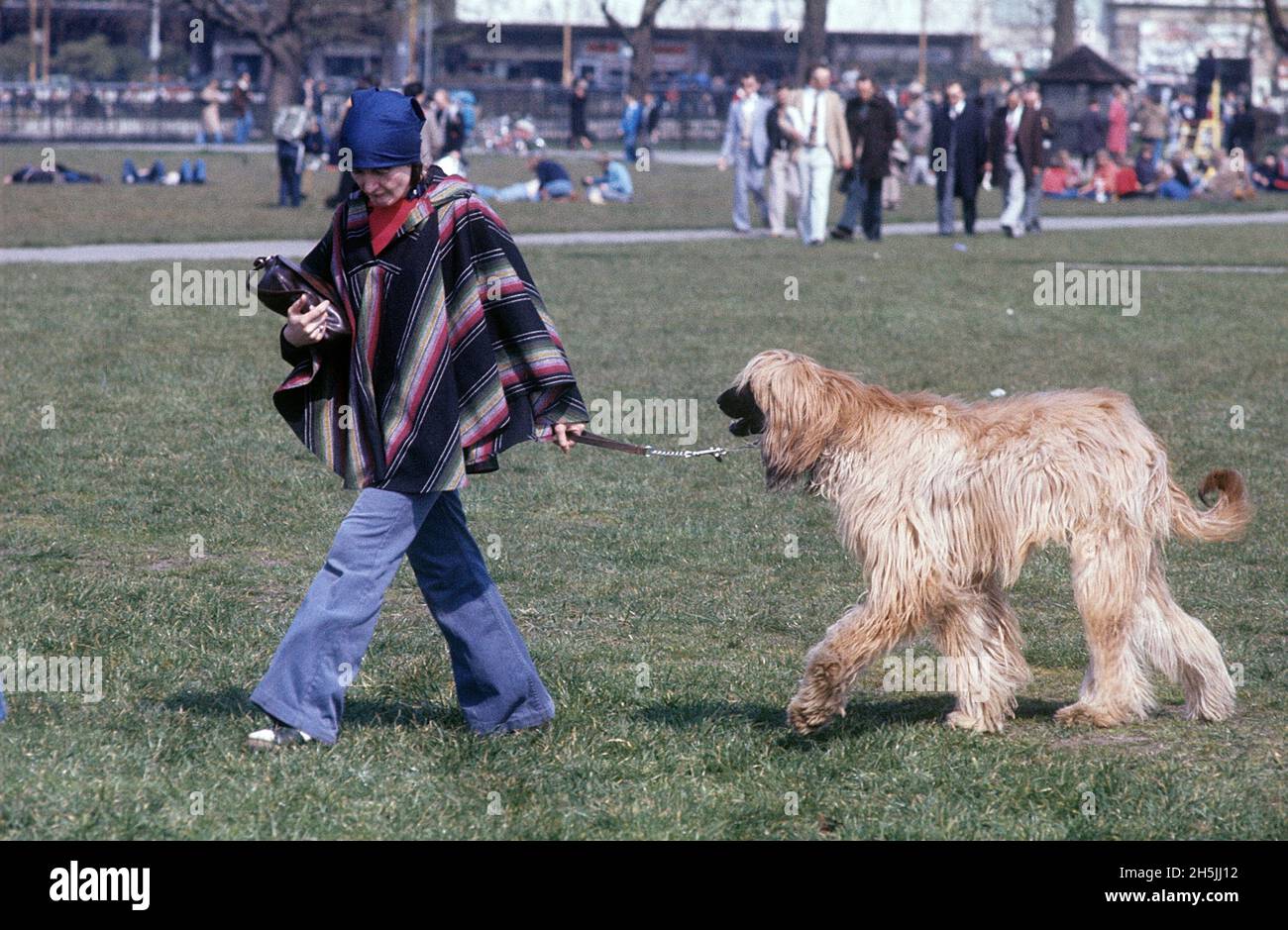London 1982. A London park and a woman walking her big dog. Credit Roland Palm. Stock Photo