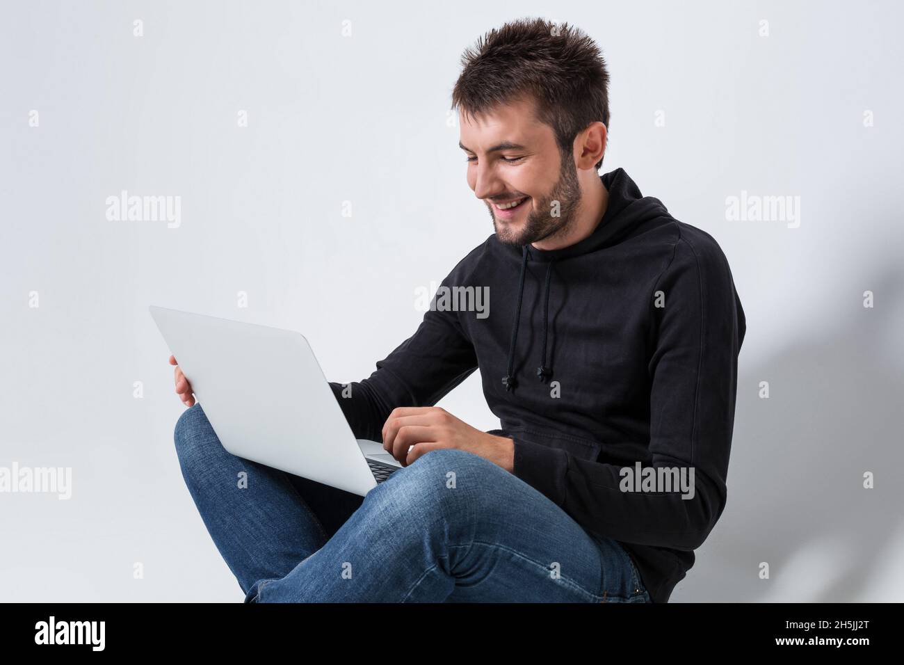 emotional man and notebook Stock Photo - Alamy