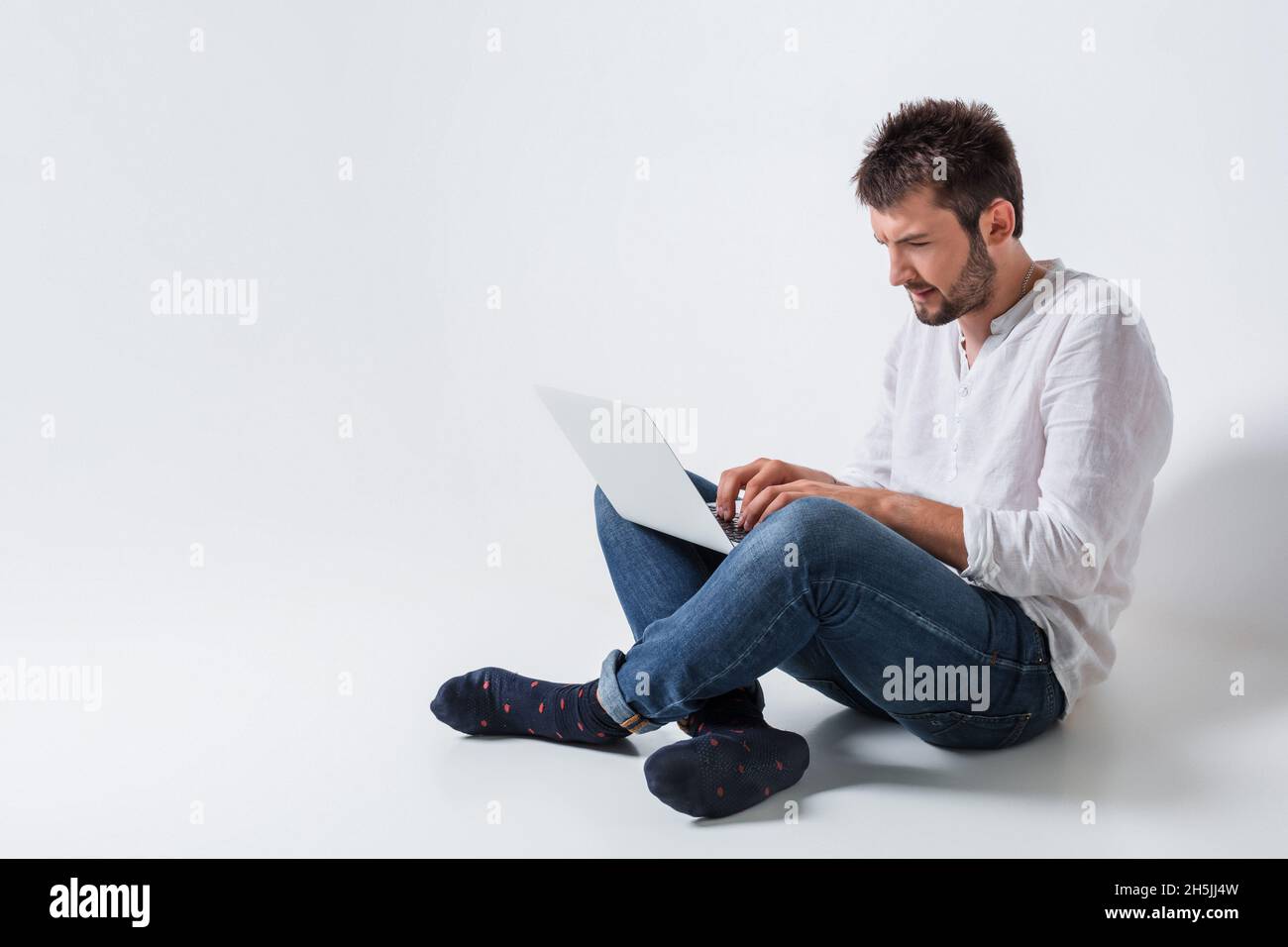 emotional man and notebook Stock Photo - Alamy
