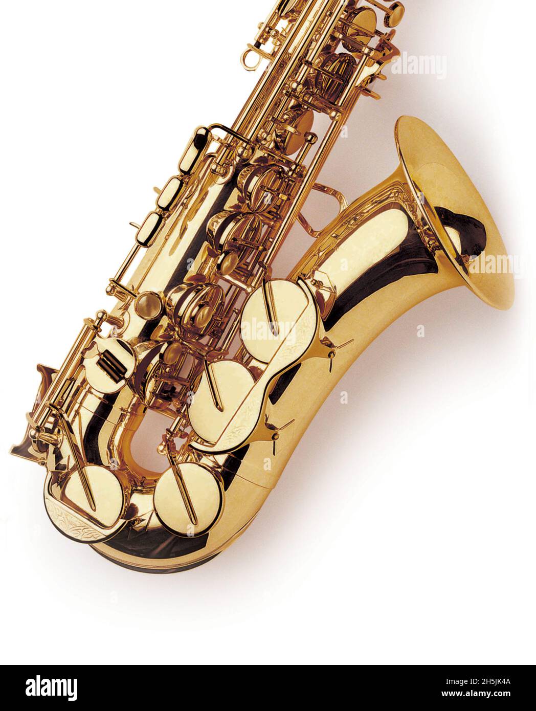 Section of a brass saxophone at an angle on white background copy space woodwind single reed musical instrument Stock Photo