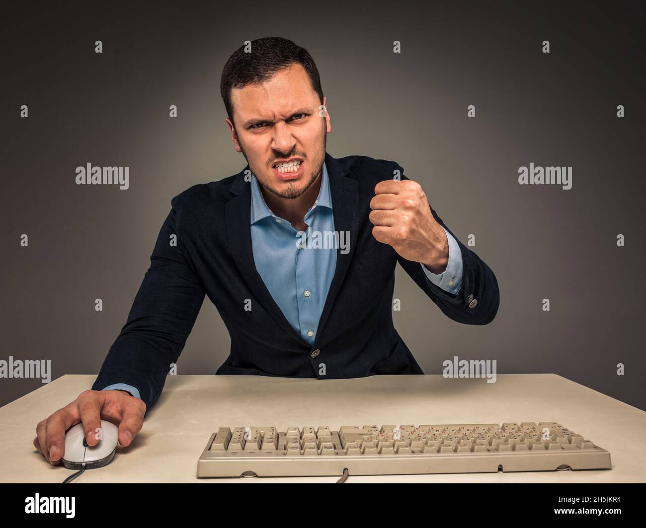 Portrait angry upset young man in blue shirt and jacket Stock Photo - Alamy