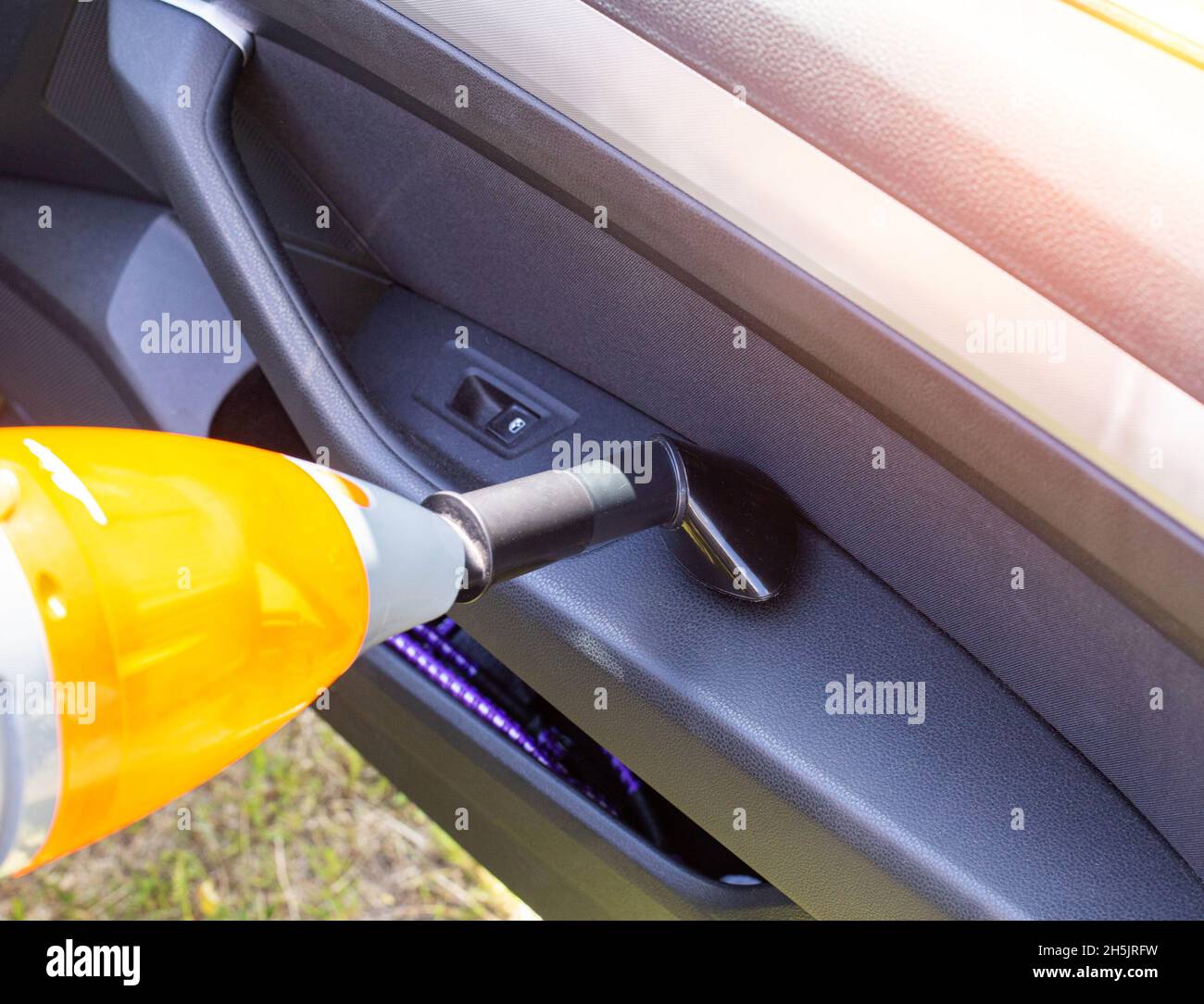 Modern car vacuum cleaner for cleaning the car interior from dust and