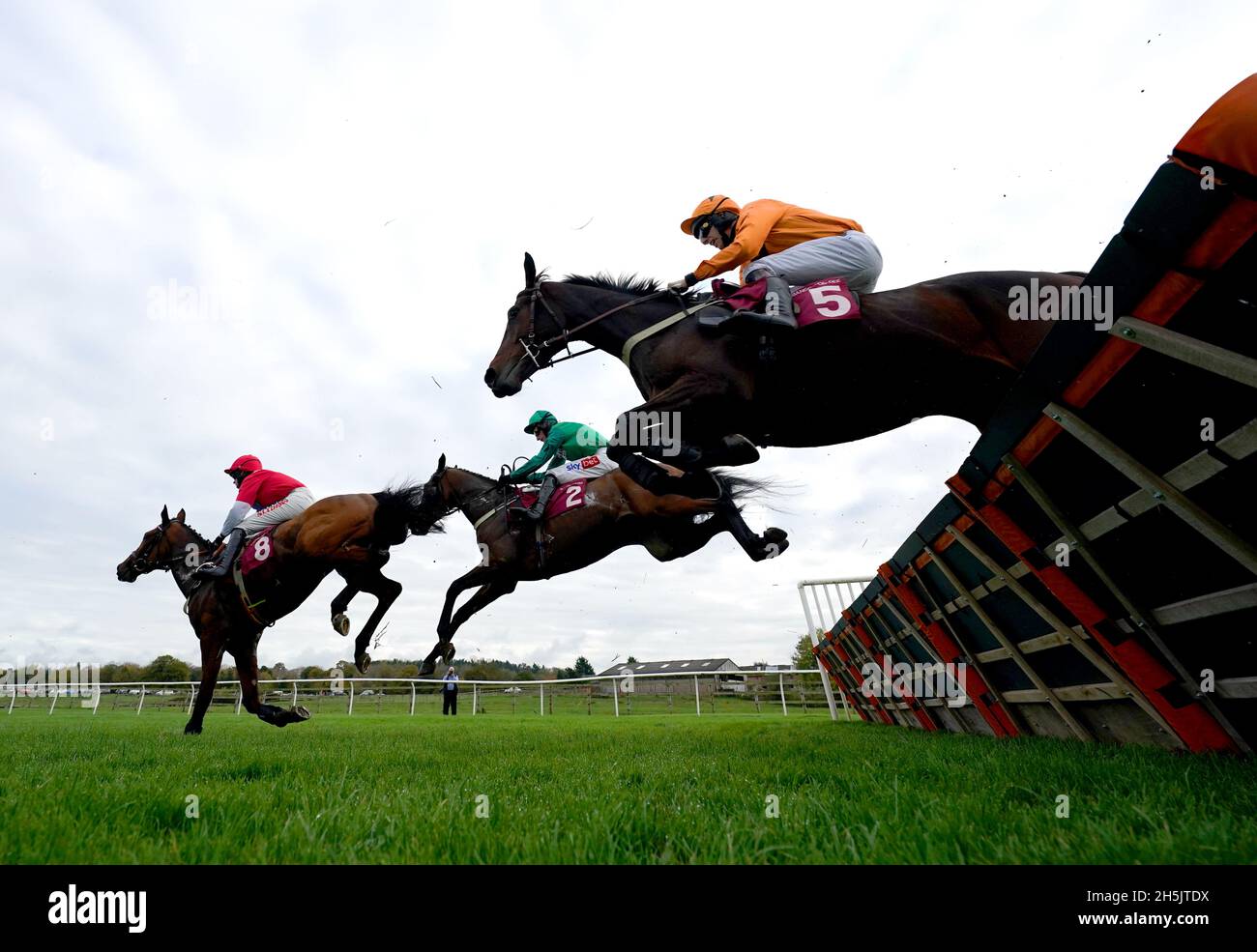 Saint Segal ridden by jockey Chester Williams (right, orange silks) clears  a hurdle on their way to winning the Ten To Follow At tote.co.uk Juvenile  Maiden Hurdle at Bangor-on-Dee racecourse. Picture date: