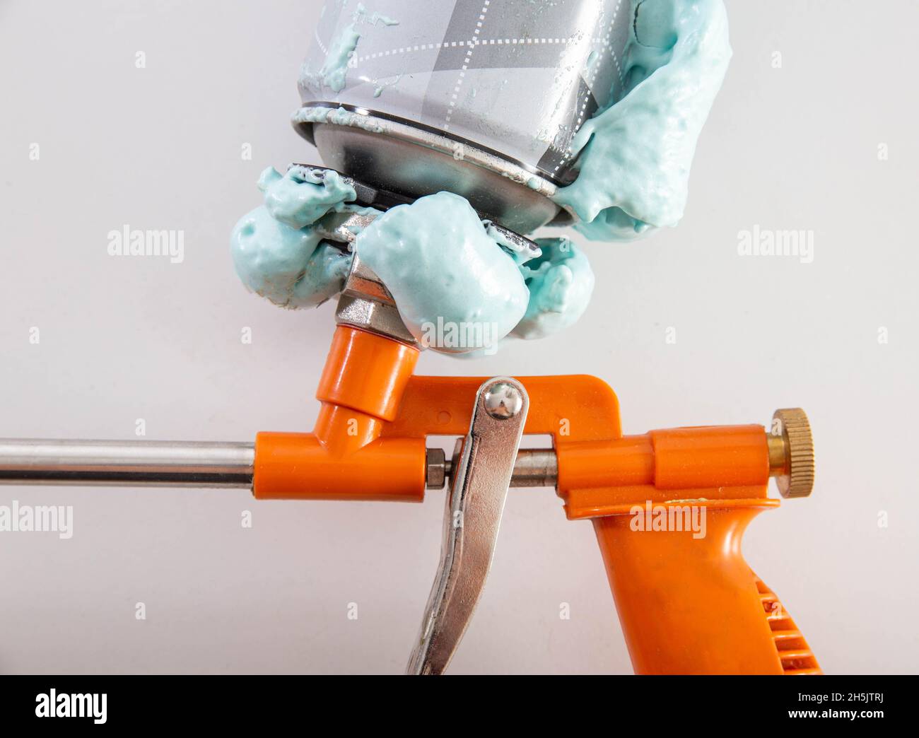 Construction foam gun with a defective cylinder. Foam bottle defect