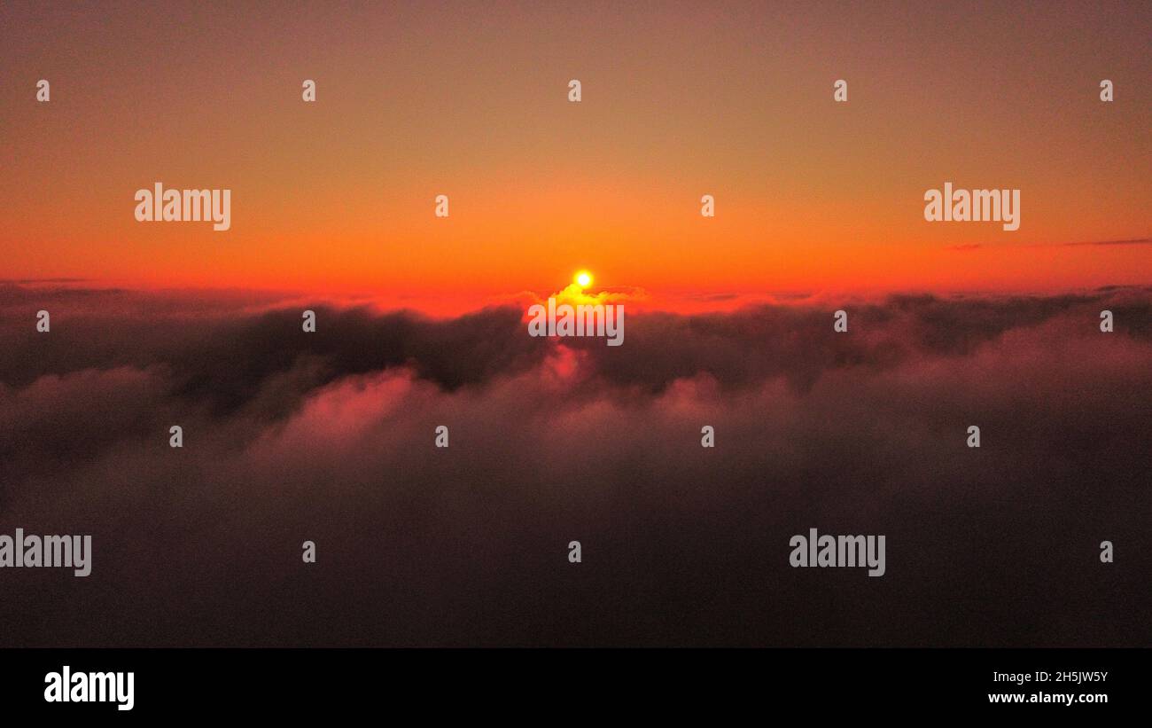 Beautiful sunset above the clouds Stock Photo - Alamy