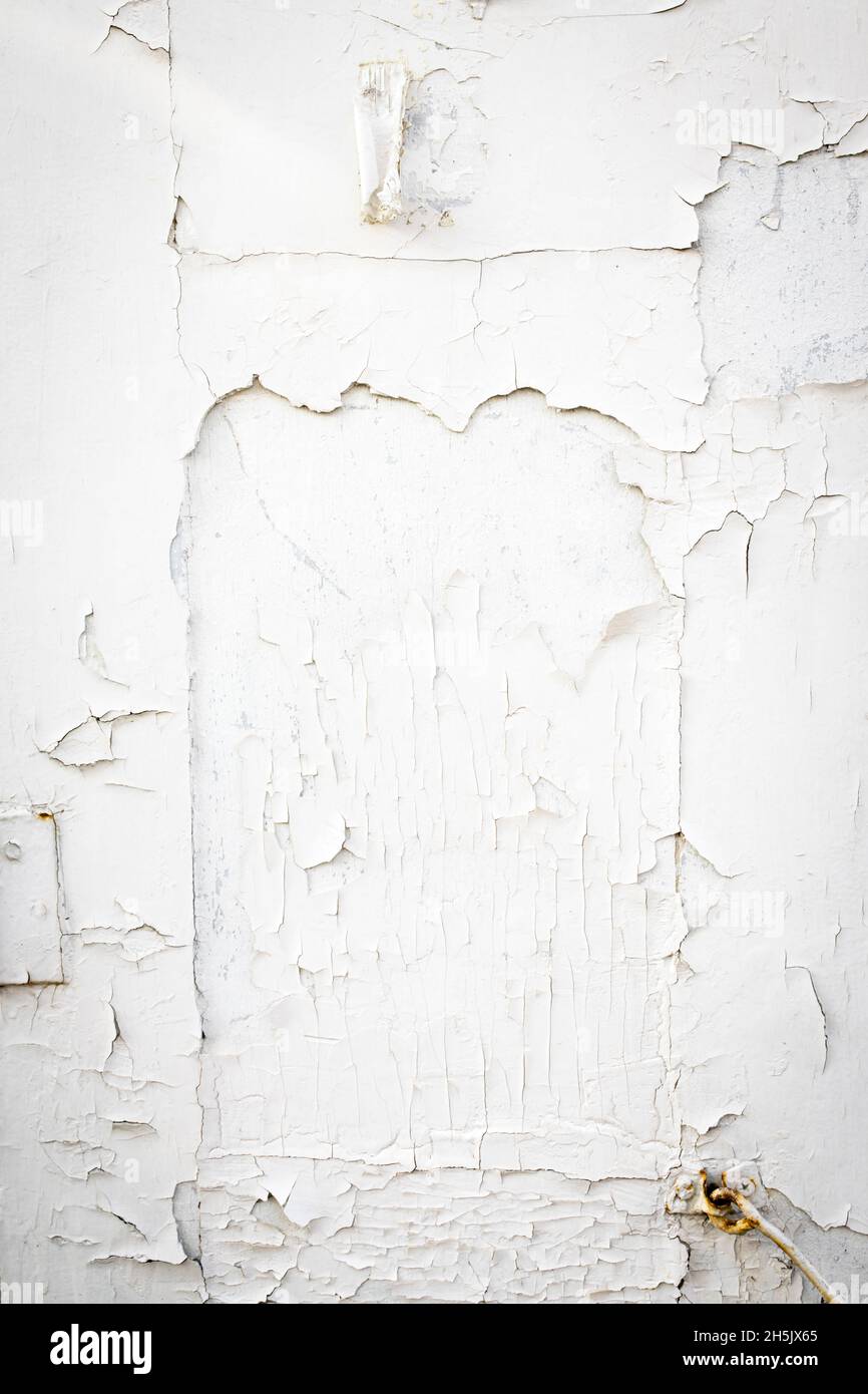 Wooden shutters are with peeling white paint Stock Photo - Alamy