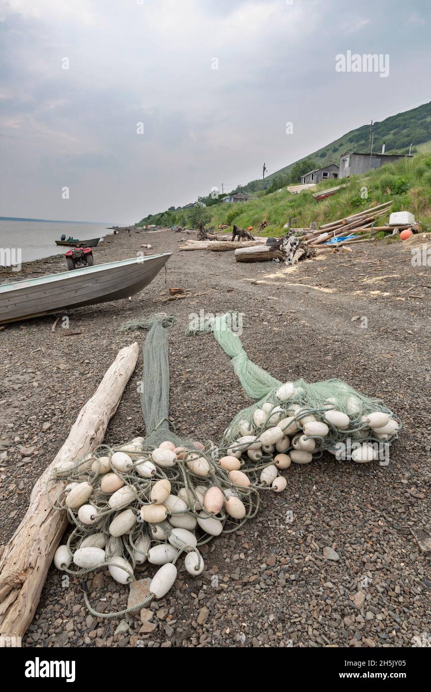 Two salmon fishing lie on the beach in Mountain Village along