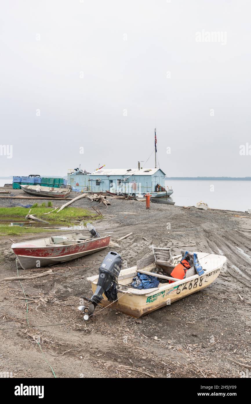 Yukon River fishing boats on the beach in front of Kwik Pak Fisheries floating fish processing plant in Mountain Village, Western Alaska, USA Stock Photo