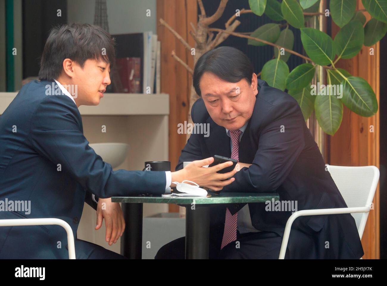 Yoon Seok-Youl and Lee Jun-Seok, Nov 6, 2021 : The presidential nominee of  the main opposition People Power Party (PPP) Yoon Seok-Youl (R) and leader  of the PPP Lee Jun-Seok attend their