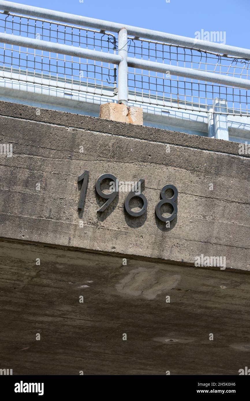 '1968', year in metal numbers on concrete bridge Stock Photo