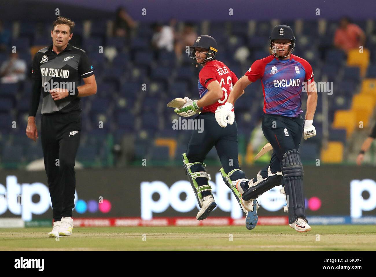 Englands Jos Buttler (centre) and Englands Jonny Bairstow score runs during of the ICC Mens T20 World Cup semi final match held at the Zayed Cricket Stadium, Abu Dhabi