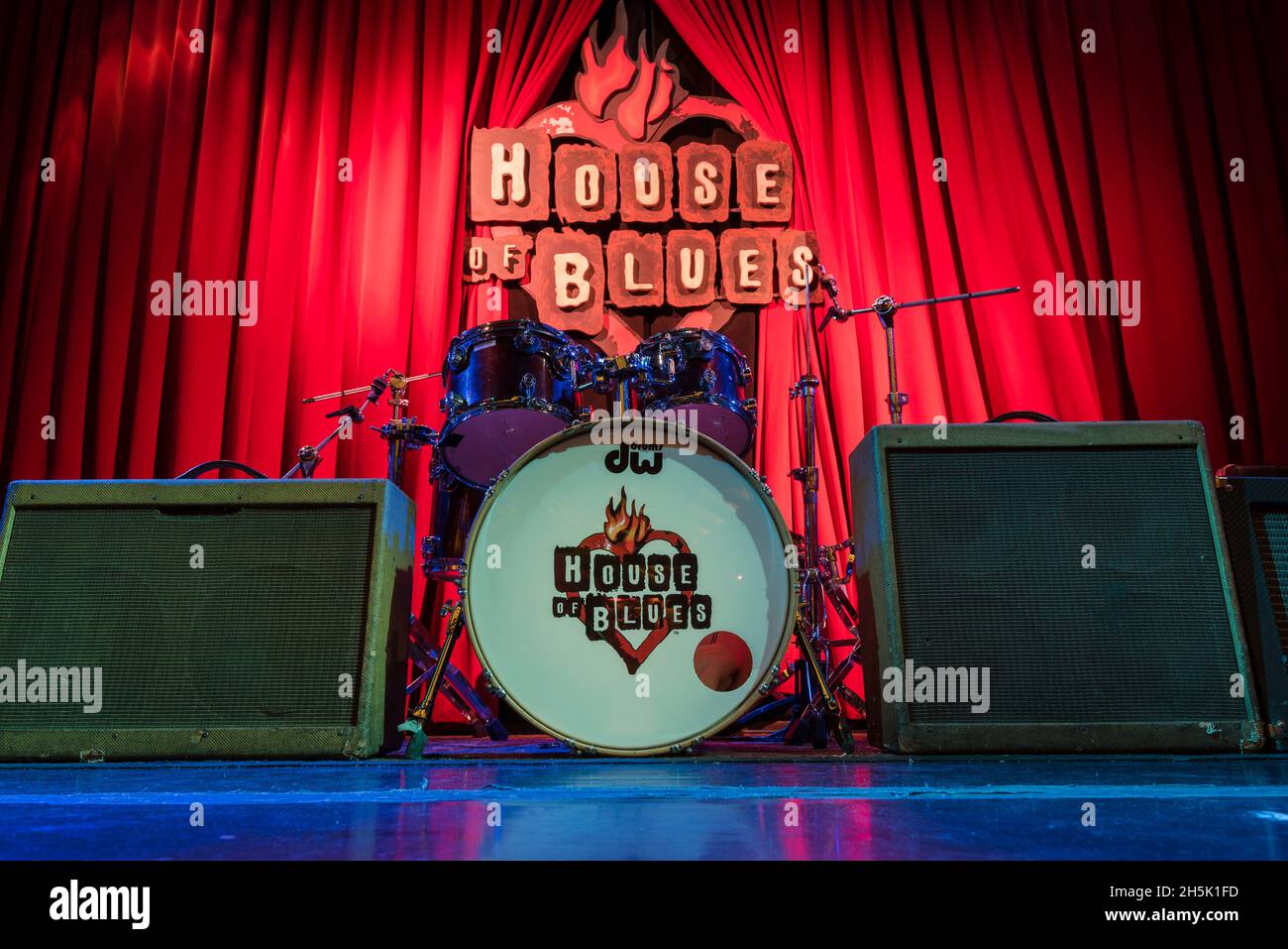 Drum set and speakers on the stage of the live music concert hall and