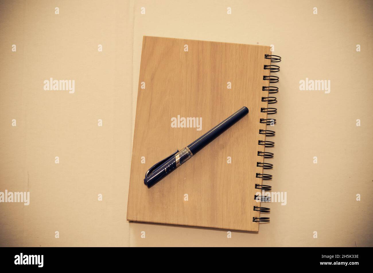 book and pen on table Stock Photo - Alamy