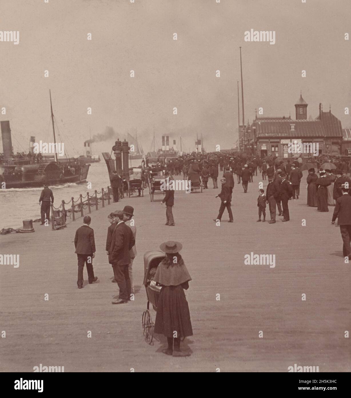 Vintage photo circa 1897 showing paddle steamers docking at the Mersey ferry landing stage in Liverpool England Stock Photo