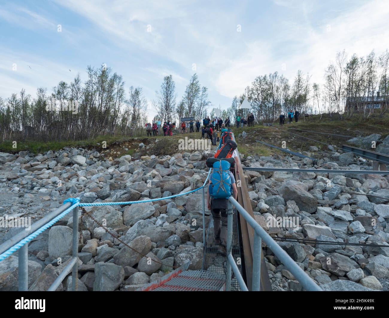 Ritsem, Norrbotten, Sweden, Agust 7, 2021: Group of hiker people at pier, get off Ferry boat ship MS Storlule at Anonjalmme, start of Padjelantaleden Stock Photo