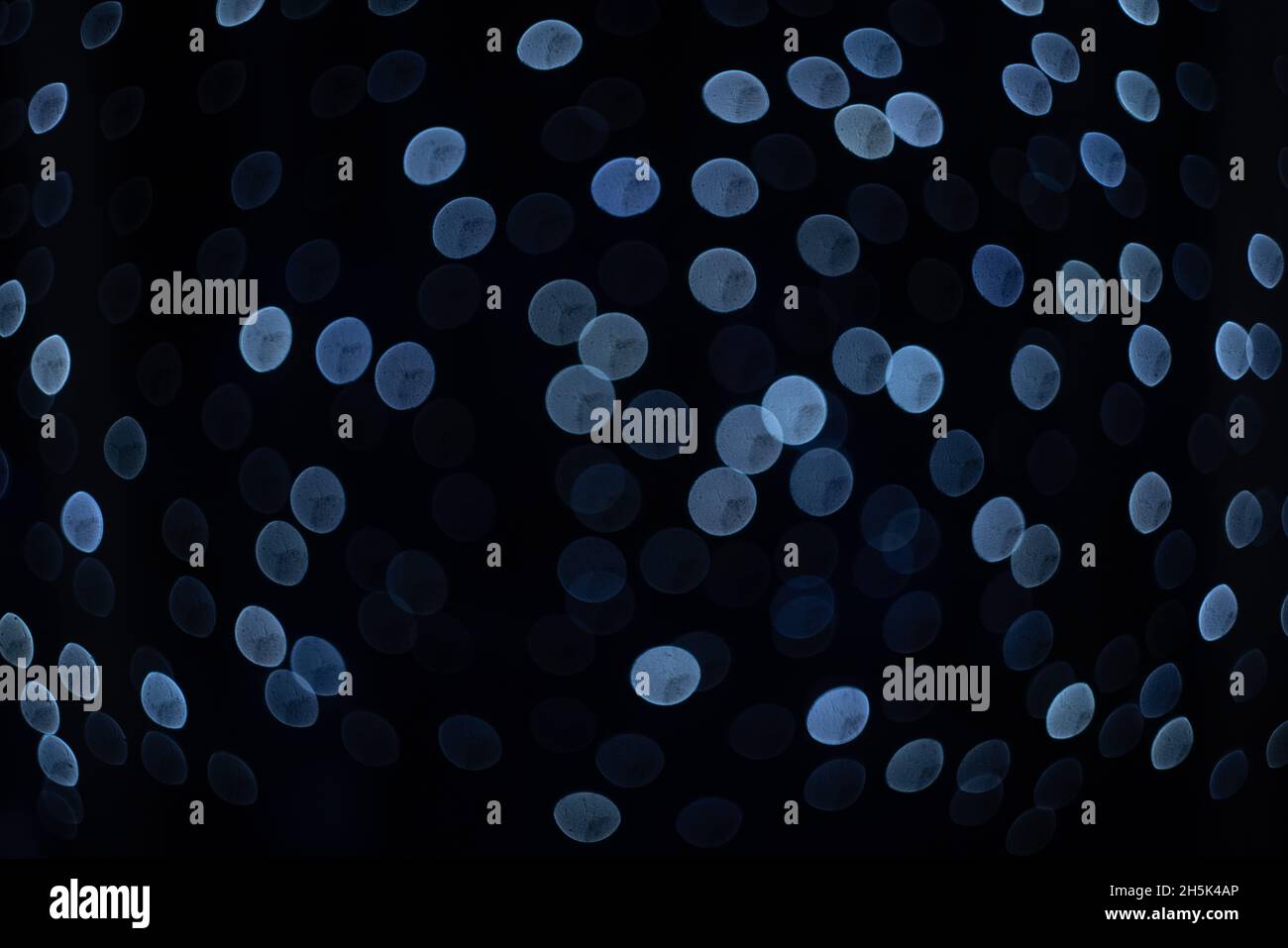 Light blue bokeh lights on dark background Stock Photo - Alamy