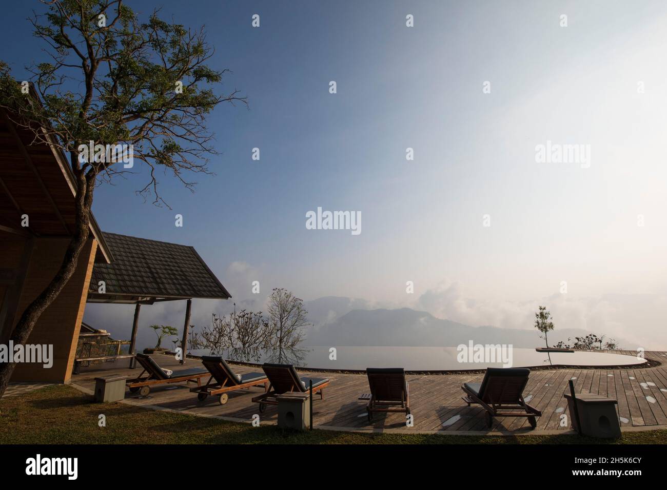 Prakriti Shakti Naturopathy Retreat with infinity pool at dawn; Kochi, Kerala, India Stock Photo