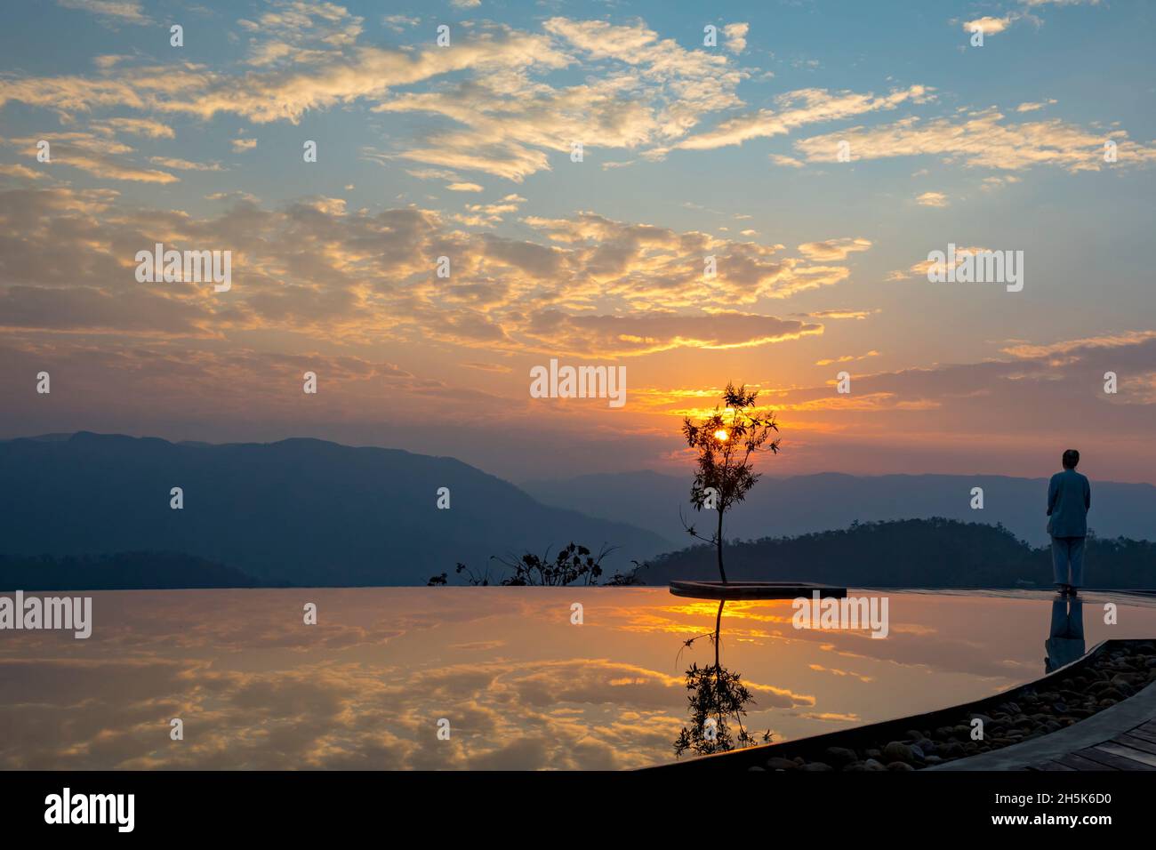 Prakriti Shakti Naturopathy Retreat with infinity pool at dawn; Kochi, Kerala, India Stock Photo