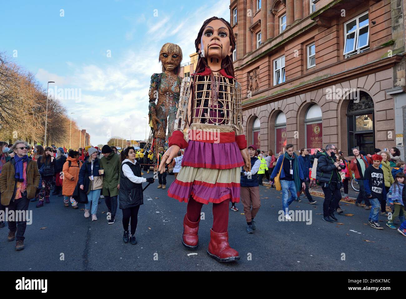 The Puppets Little Amal and Storm meet and walk together in Govan at COP 26 Glasgow Stock Photo