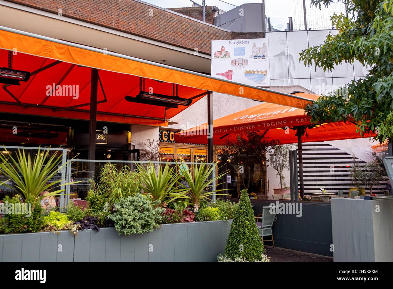 Kingston Upon Thames London England UK November 5 2021, Restaurant Open Air Terrace Eating Area With Orange Canopies And Heaters With No People Stock Photo