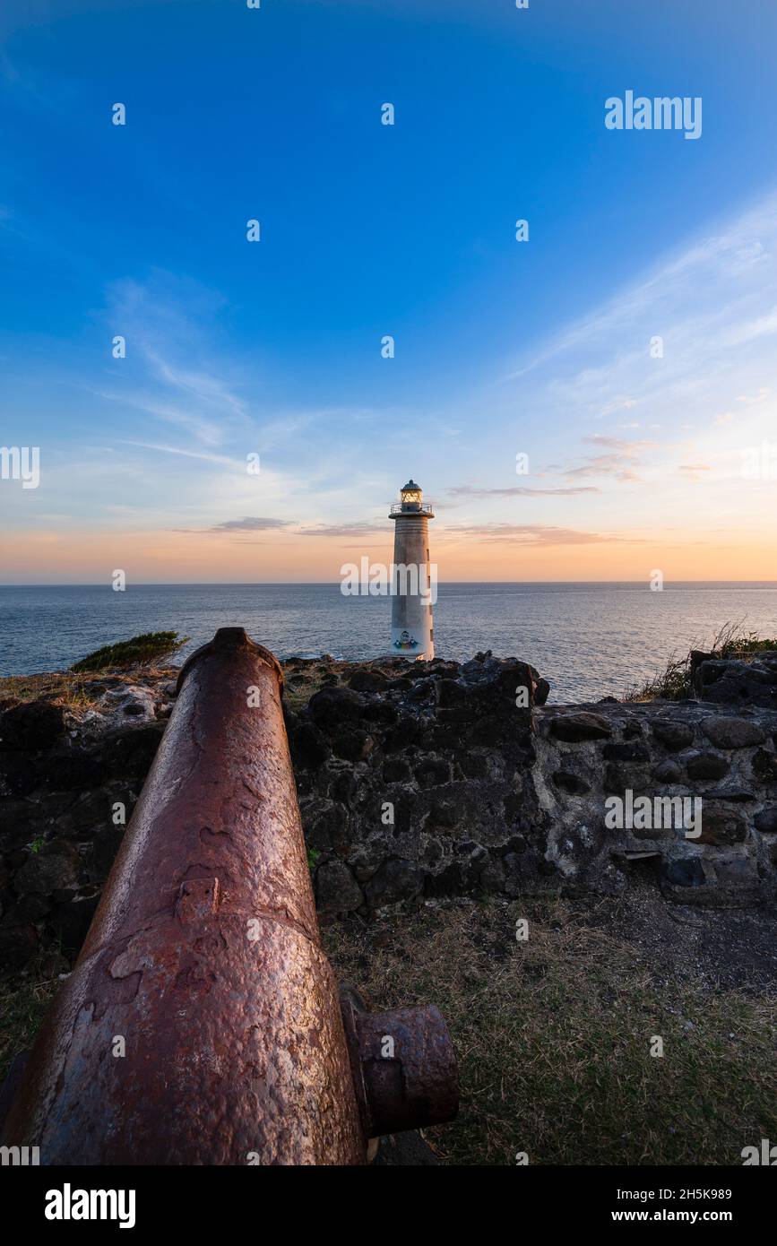 Lighthouse at Pointe du Vieux Fort overlooking the Caribbean Sea at sunset, southernmost point of Guadeloupe Stock Photo