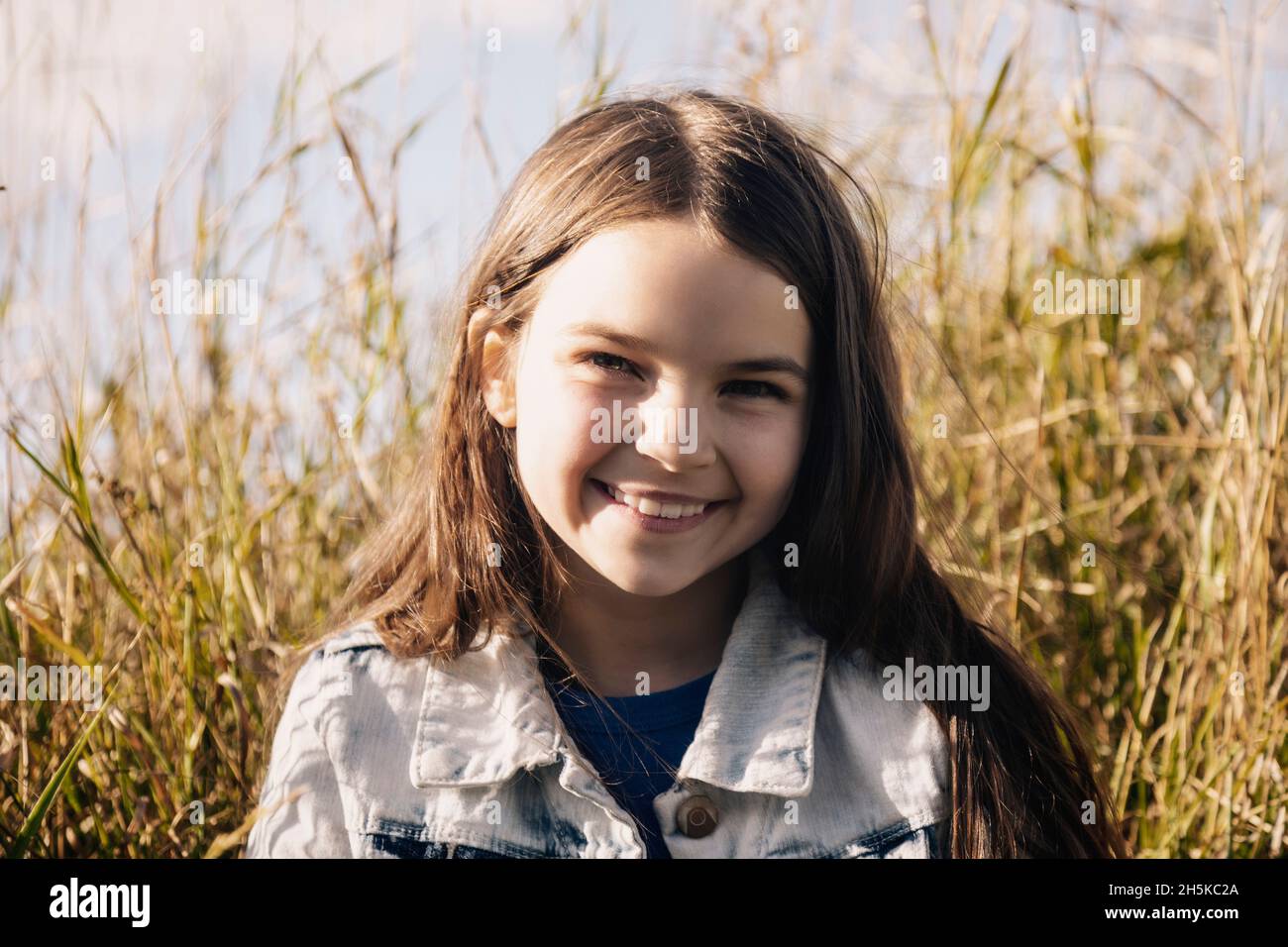 Portrait of a preteen girl with long brunette hair; Alcomdale, Alberta