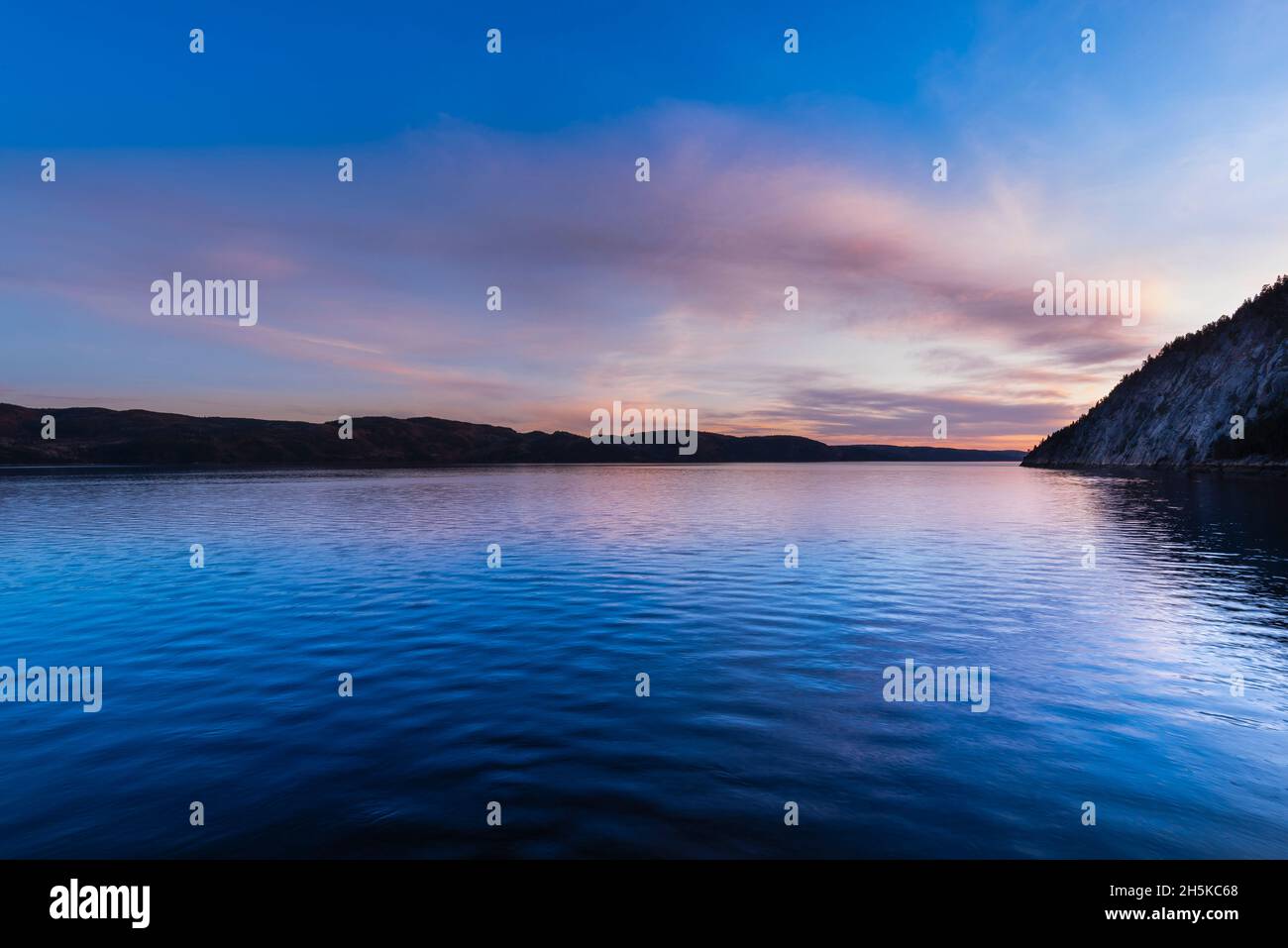 Saguenay Valley at sunset, viewed from the dock of SainteRoseduNord along the Saguenay River