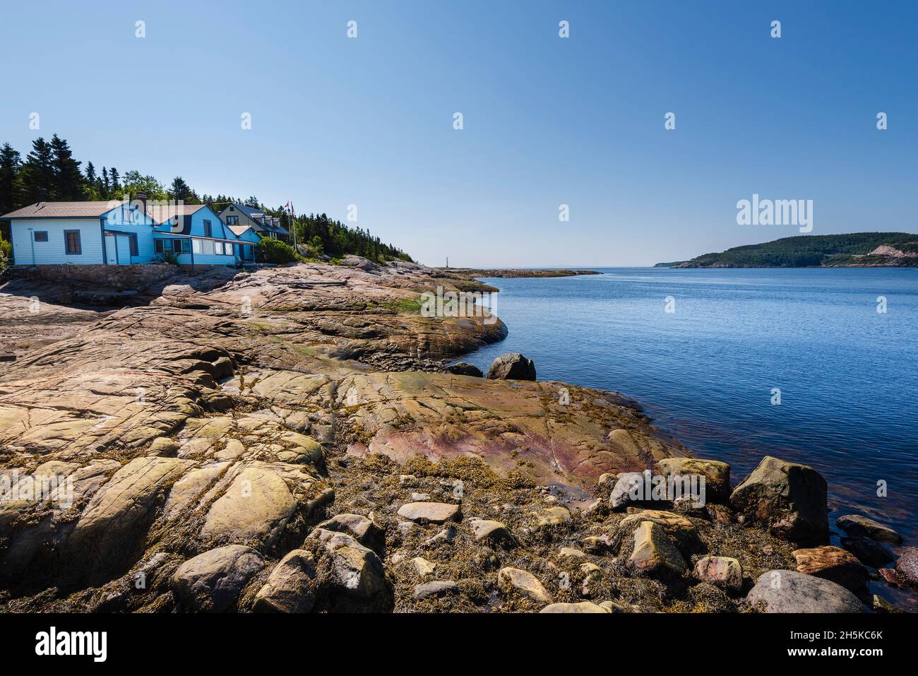 House and shoreline along the St. Lawrence River at Tadoussac, Quebec