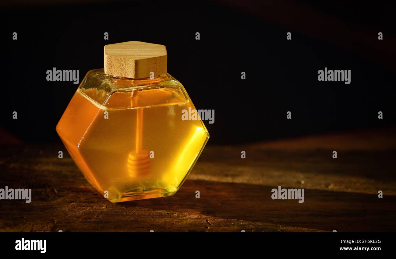 Vintage Closeup Jar with Honey on Wooden Table Stock Photo