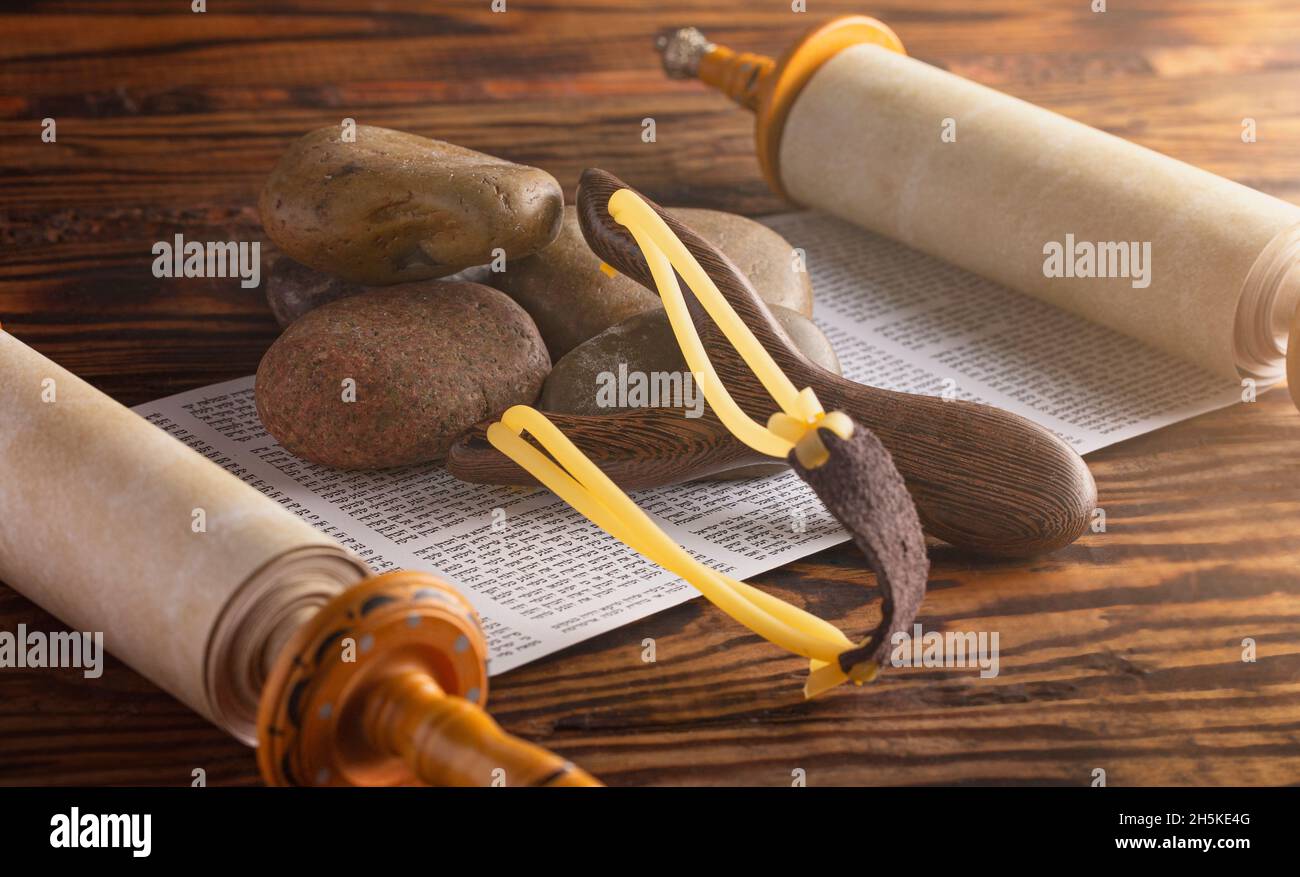 Five Smooth Stones and a Sling Shot on a Hebrew Scroll Symbolising the